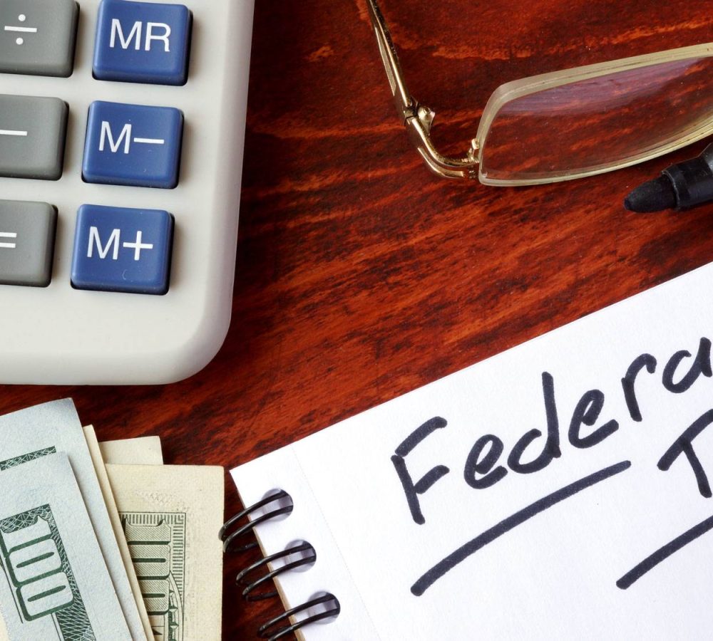 Federal-Income-Tax-Changes-Federal-tax-written-on-notepad