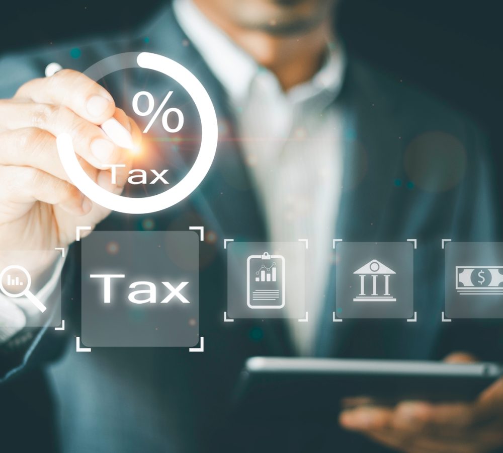 Businessman,Calculates,Tax,For,Individual,Income,Tax,Return,Form,Online